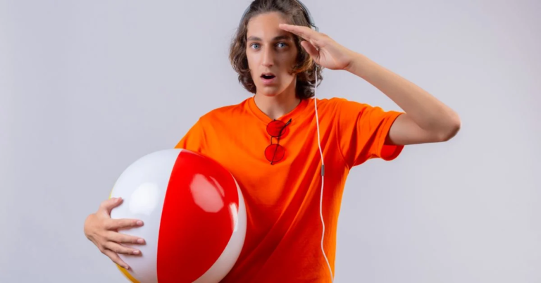 A woman is stading and holding a volleyball look like a volleyball Puns
